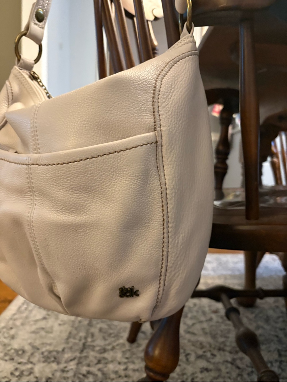 The Sak Cream Leather Hobo Shoulder Bag with Brass Accents